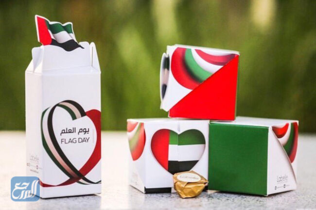 صور توزيعات يوم العلم الإماراتي